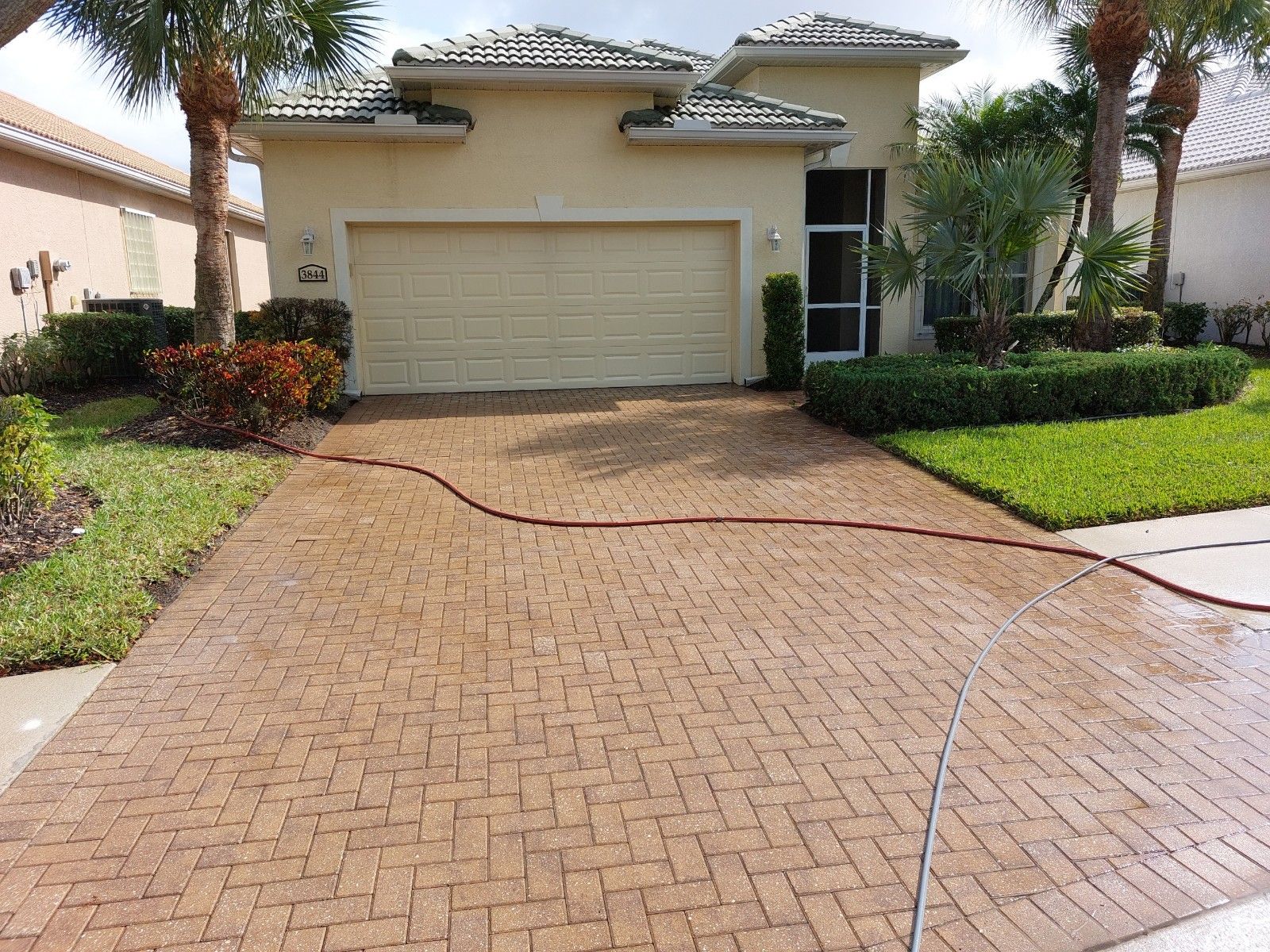 Paver driveway after pressure washing — Naples FL