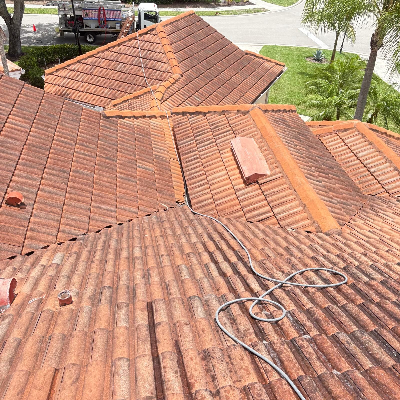 Tile roof aerial view before cleaning — SW Florida