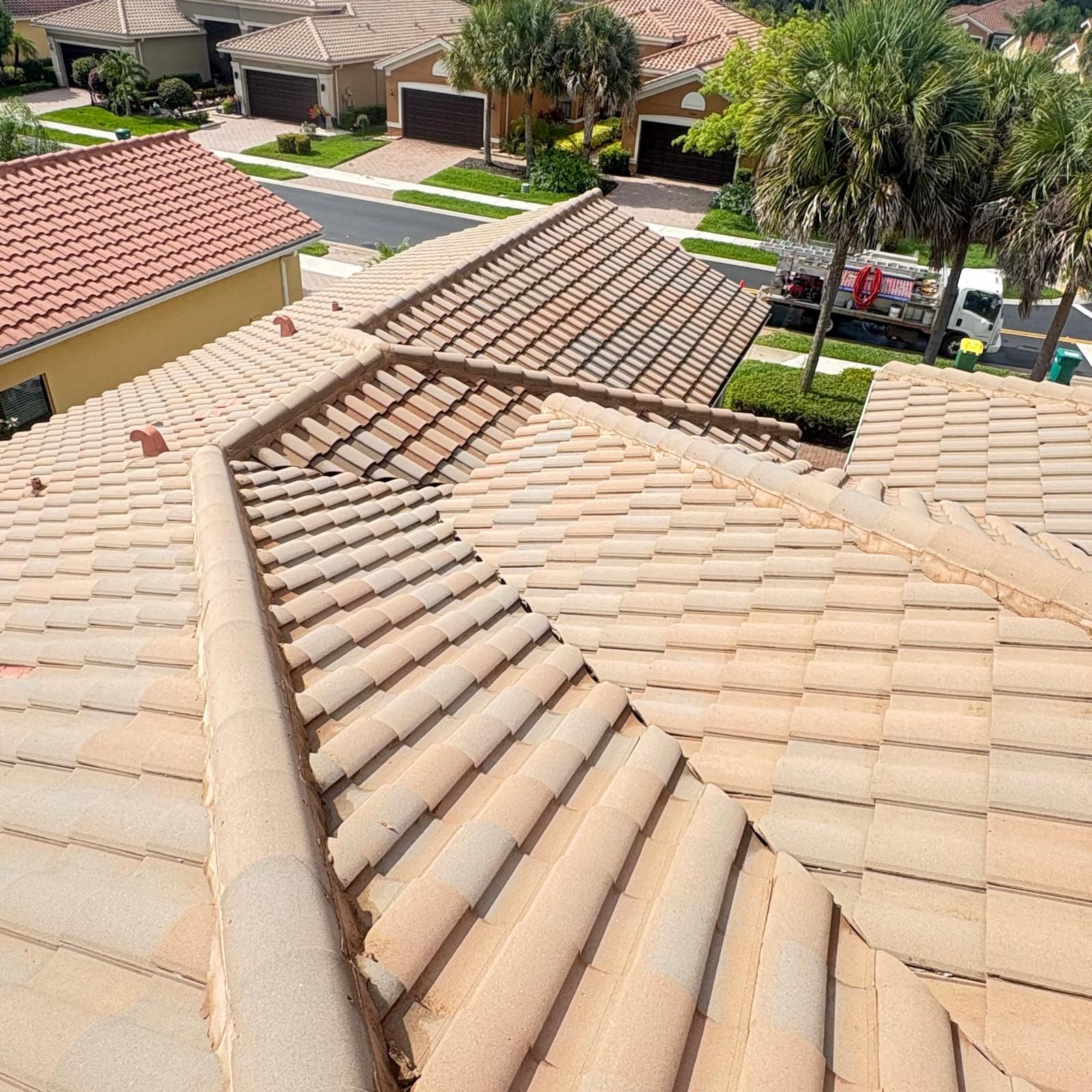 Clean barrel tile roof after pressure washing — HOA community SW Florida
